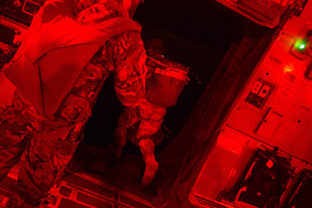 A paratrooper jumps out of a C17 Globemaster III aircraft over Sicily drop zone during Battalion Mass Tactical Week at Pope Army Airfield, N.C., July 12, 2016. Air Force photo by Staff Sgt. Sandra Welch