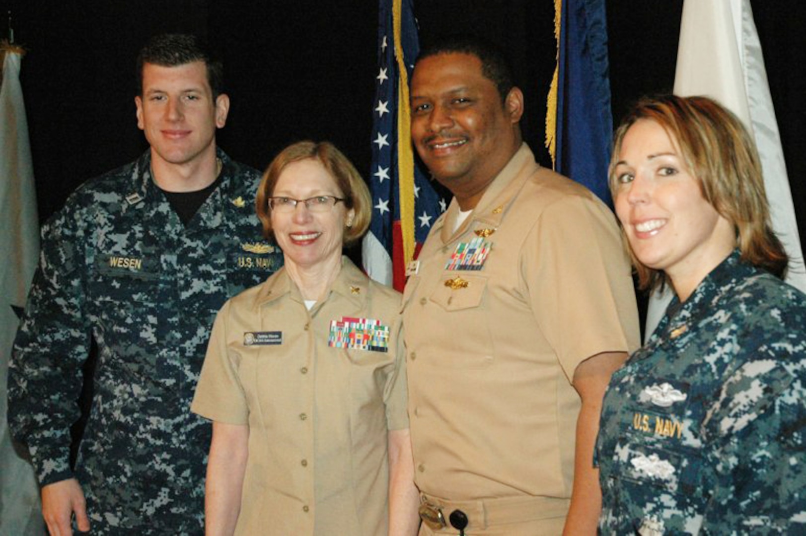 Navy Rear Adm. Deborah Haven (second from left), DCMA
International commander, joins members of DCMA’s Boeing St. Louis staff at the recent Professional Development Day program for Navy reserve and active duty supply corps officers at Scott Air Force Base, Ill. (Pictured from left) Navy Lt. Lance Wesen, contracts manager; Haven; Navy Lt. Cmdr. Greg Alexander, executive operations officer;
and Navy Lt. Dina Glasper, price and cost analyst.