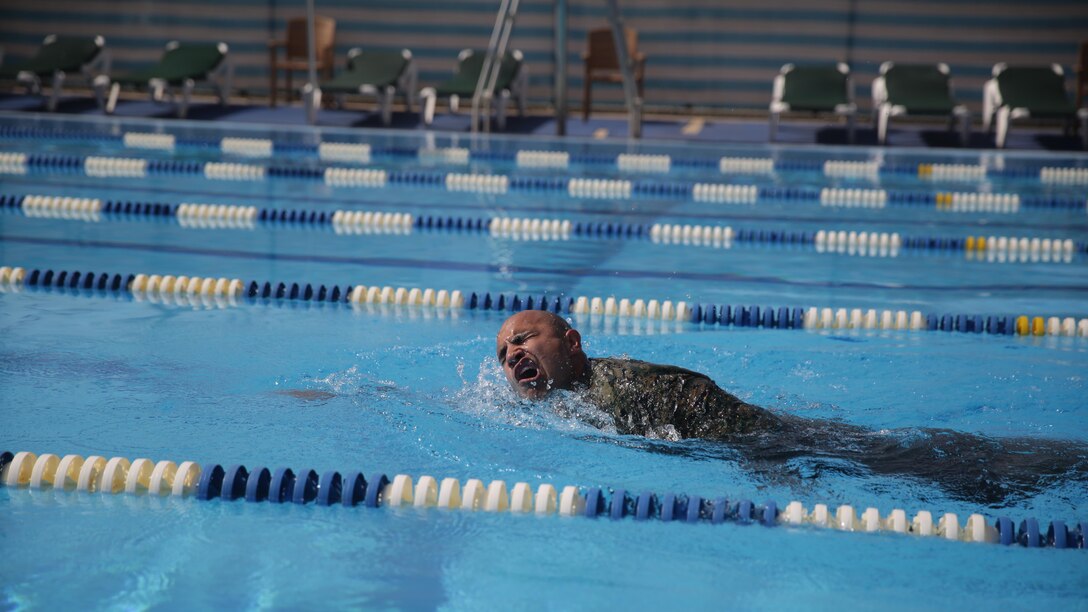 Staff Sgt. Alex Quinones, a platoon commander with Special Purpose Marine Air-Ground Task Force Crisis Response-Africa, takes a breath during his 100-meter timed swim during a fitness test for the German Armed Forces Badge for Military Proficiency at Naval Air Station Sigonella, Italy, July 6, 2016.  Marines with 1st Battalion, 8th Marine Regiment completed the test and earned the decoration of the Bundeswehr, the armed forces of the Federal Republic of Germany.