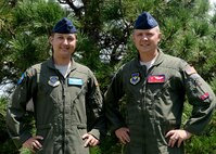 U.S. Air Force Capt. Justin Kellett, C-5 Galaxy pilot and U.S. Air Force Capt. Kyle Kellett, C-17 Globemaster III pilot, pose for a photo, July 12, 2016 at Altus Air Force Base. Close in age, the brothers have spend their entire lives in similar paths of life and now find themselves temporarily at Altus Air Force Base together.(U.S. Air Force Photo by Airman Jackson N. Haddon/Released).