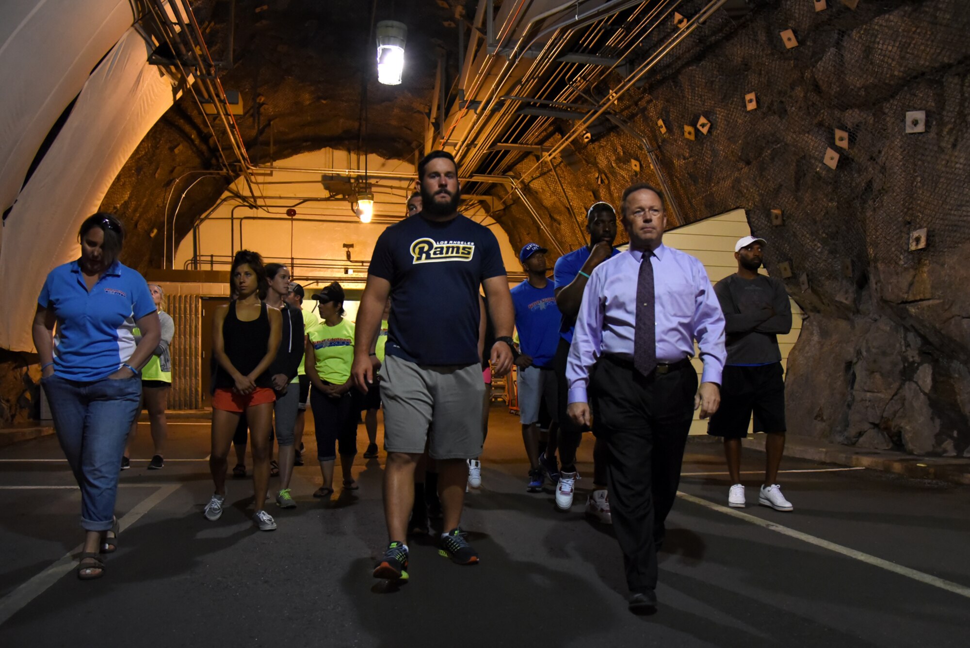 CHEYENNE MOUNTAIN AIR FORCE STATION, Colo. – Steven Rose, 721st Mission Support Group deputy commander, guides NFL players on a tour of Cheyenne Mountain Air Force Station, Colo., July 13, 2016. The players toured the facilities as a part of the CMAFS 50th year celebration. (U.S. Air Force photo by Airman 1st Class Dennis Hoffman)