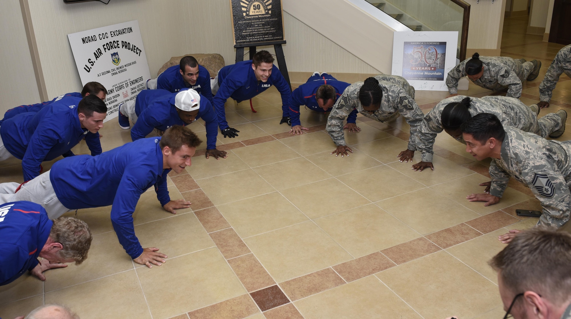 CHEYENNE MOUNTAIN AIR FORCE STATION, Colo. – Members of the U.S. Men’s Olympic Gymnastics team do 22 pushups with members of the 721st Mission Support Group at Cheyenne Mountain Air Force Station, Colo., July 14, 2016. The gymnasts were at CMAFS to meet Airmen, get a tour of the facilities and learn about its mission. (U.S. Air Force photo by Senior Airman Rose Gudex)