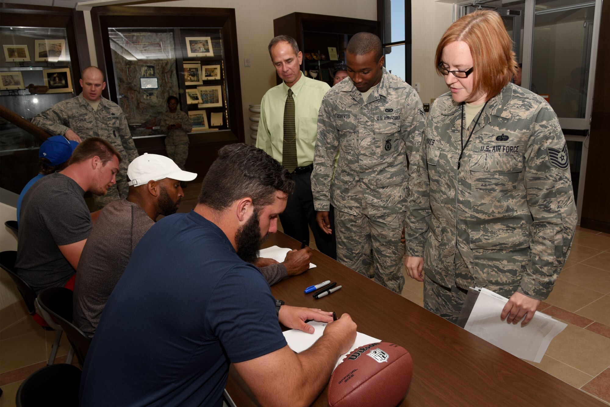 CHEYENNE MOUNTAIN AIR FORCE STATION, Colo. – Players from the NFL meet and sign autographs for Airmen at Cheyenne Mountain Air Force Station, Colo., July 13, 2016. The players were in Colorado Springs for a youth football camp they helped coach. (U.S. Air Force photo by Airman 1st Class Dennis Hoffman)