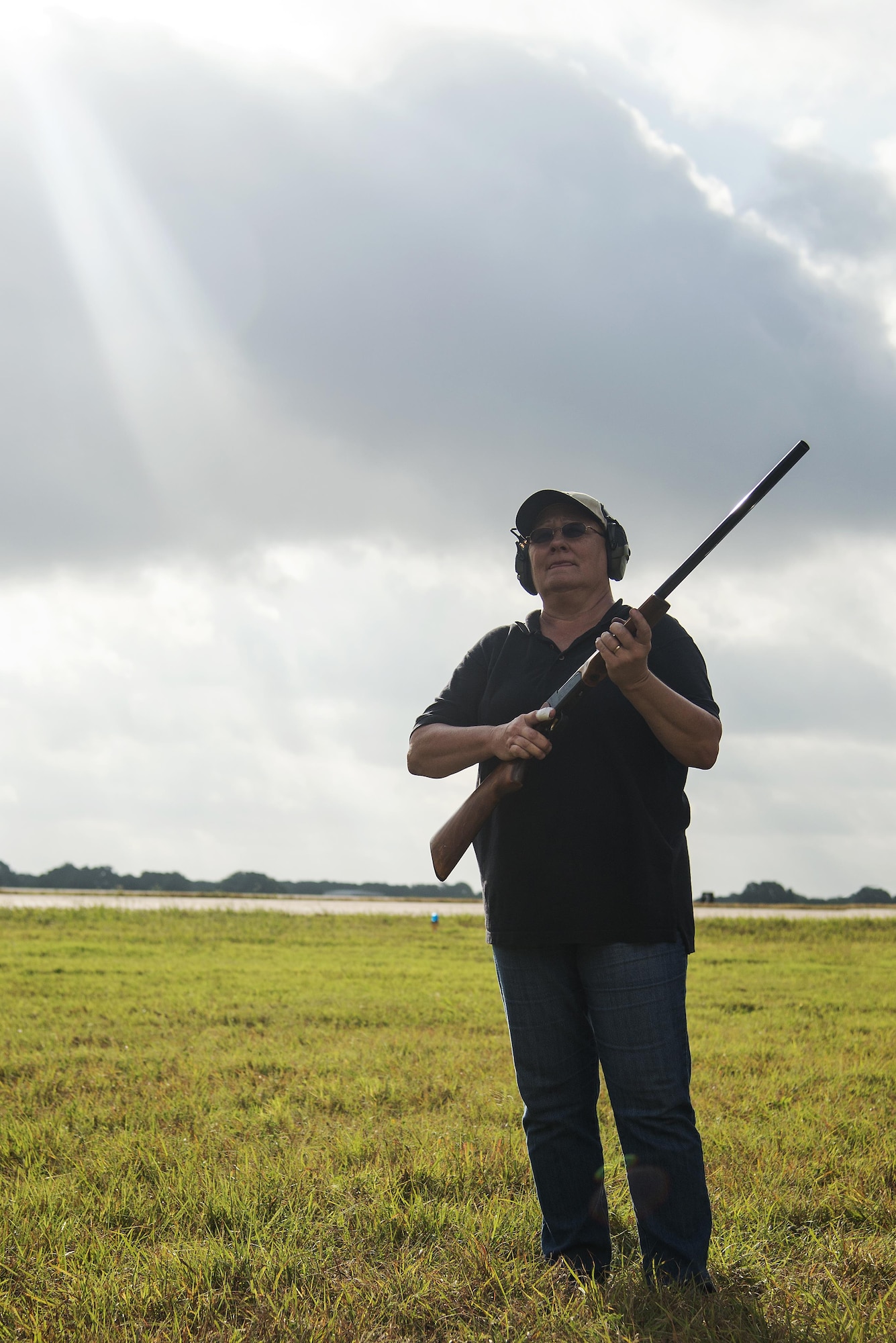 Vivian Prothro, U.S. Department of Agriculture staff wildlife biologist, prepares to fire a 15 mm. Bird Banger near the east flight line July 13, 2016 at Joint Base San Antonio-Randolph. Bird/Wildlife Aircraft Strike Hazard Program team members use bangers, screamers and cracker shells, which are various types of pyrotechnics, to scare birds and wildlife away from where aircraft are taking off and landing.  