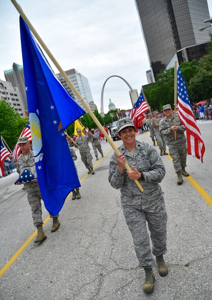 932nd Airlift Wing community outreach in action shows Saint Louis that our reservists are Citizen Airmen and get involved locally.  Lt. Col. Julie Novy, 932nd Airlift Wing Director of Staff, carries the Air Force flag with other 932nd AW wing volunteers on a 1.5 mile walk in the Saint Louis Independence Day "VP" parade earlier this month. The 22nd Air Force unit, located at Scott Air Force Base, flies the C-40C aircraft for distinguished visitor airlift and is known as "The Gateway Wing" with Air Force Reserve Command members living and working on both sides of the Mississippi River. (U.S. Air Force photo by Tech Sgt. Christopher Parr)