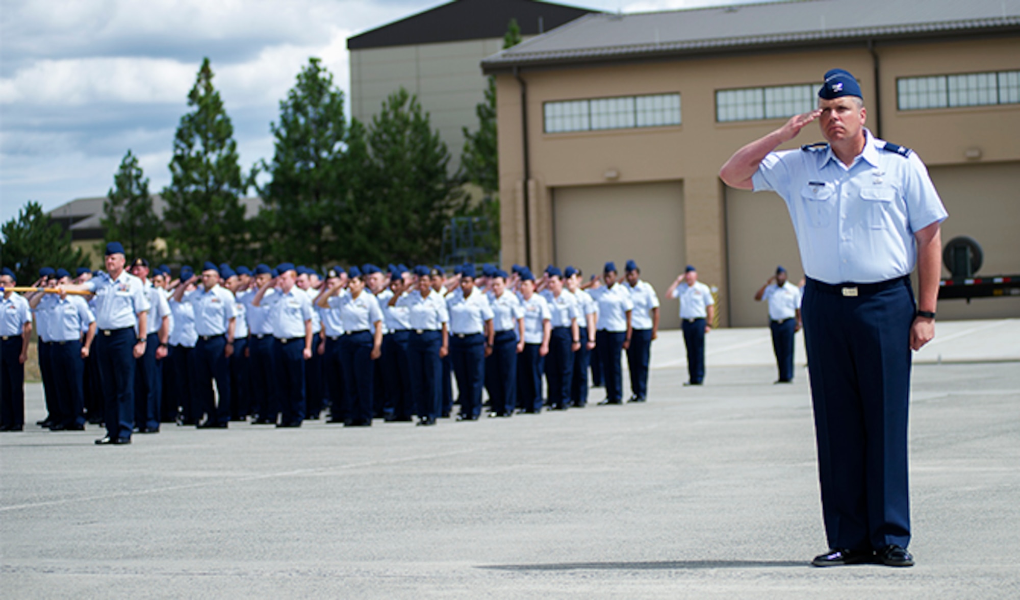 Col. Mathew Fritz, 92nd Air Refueling Wing vice commander, offers a first salute to Col. Ryan Samuelson, 92nd ARW commander, during a change of command ceremony July 19, 2016, at Fairchild Air Force Base. Samuelson assumed command of the 92nd ARW from Col. Brian McDaniel. The ceremony was officiated by Lt. Gen. Samuel Cox, 18th Air Force commander. (U.S. Air Force photo/Airman 1st Class Sean Campbell)