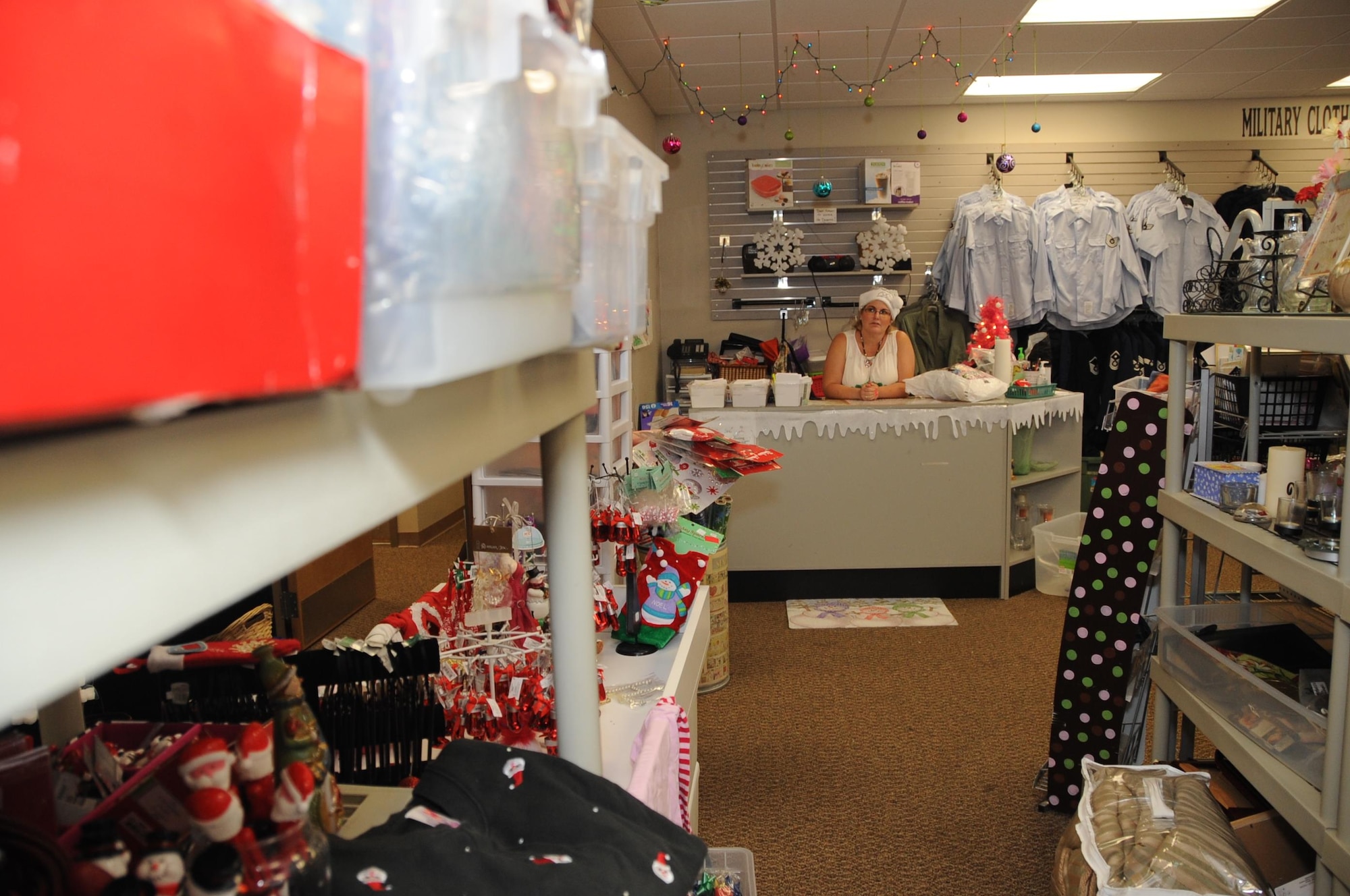 An Airman’s Attic volunteer waits to assist customers at Barksdale Air Force Base, La., July 14, 2016. The target shopper for the Airman’s Attic is E-4 and below, however, they do have all ranks days during the month as well. All active duty ranks can shop for military uniforms anytime of the month. (U.S. Air Force Photo/Airman Alexis C. Frost)