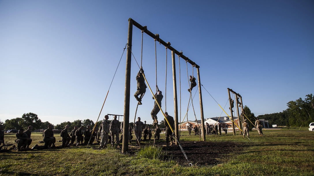 Candidates with India Company, Officer Candidate School, conduct the obstacle course at Marine Corps Base Quantico, Virginia, July 17, 2016. The mission of OCS is to educate and train officer candidates in order to evaluate and screen individuals for qualities required for commissioning as a Marine Corps officer.