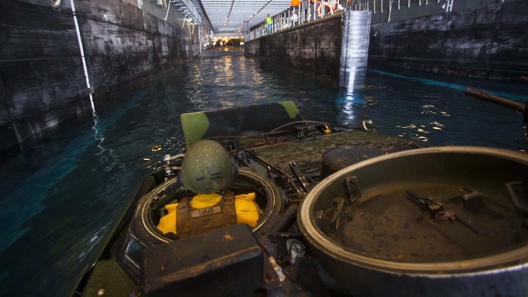 Lance Cpl. Ryley Sweet drives an assault amphibious vehicle from amphibious assault ship USS America to Royal Australian Navy Canberra class amphibious ship HMAS Canberra. The Marines are participating in the Rim of the Pacific 2016, a multinational military exercise, from June 29 to Aug. 8 in and around the Hawaiian Islands. Participation in RIMPAC will help us develop mutual trust and respect across the joint and combined team through increased understanding of allied and partner cultures, competencies, and capabilities. Sweet is an assault amphibious vehicle driver with Combat Assault Company, 3rd Marine Regiment and is a native of Kansas City, Miss.