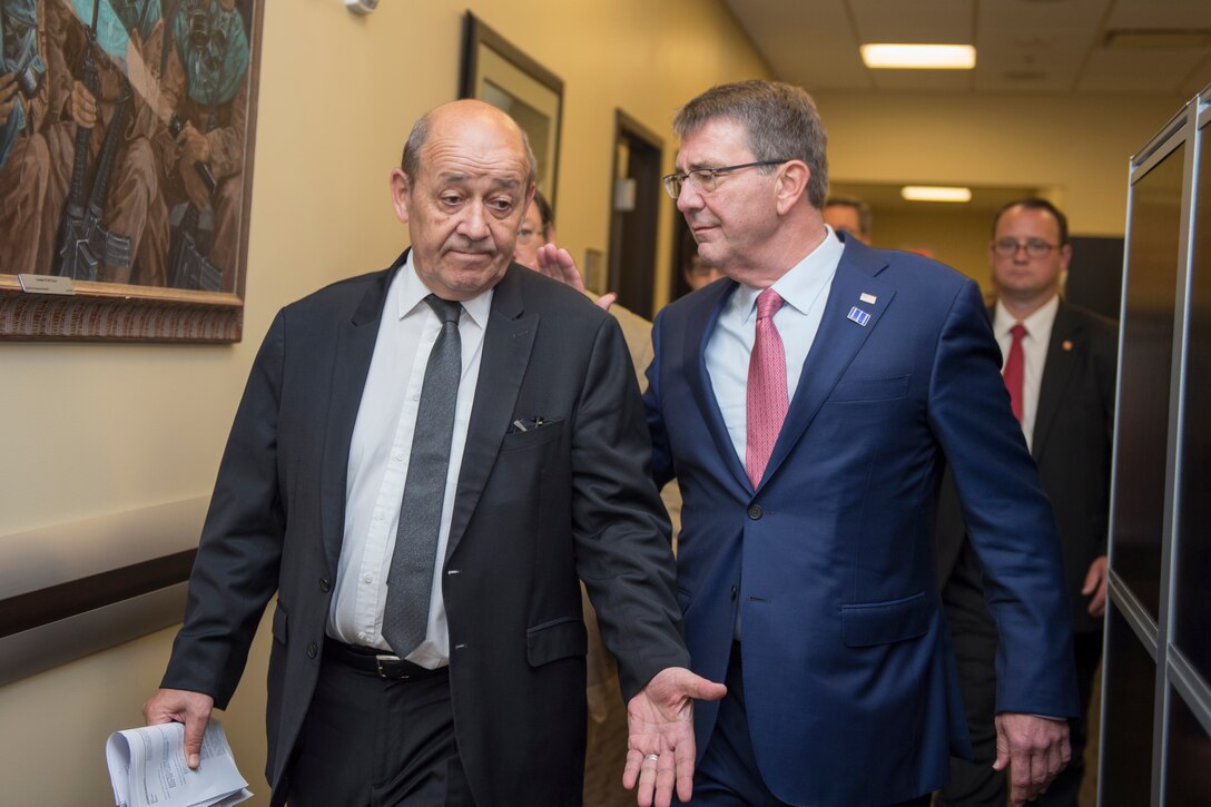 Defense Secretary Ash Carter, right, talks with French Defense Minister Jean-Yves Le Drian during a meeting of defense ministers and senior leaders from the coalition to counter the Islamic State of Iraq and the Levant at Joint Base Andrews, Md., July 20, 2016. DoD photo by Air Force Tech. Sgt. Brigitte N. Brantley