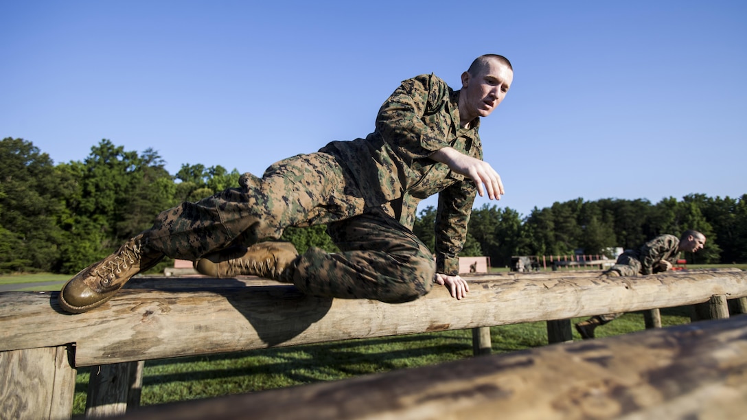 Candidates with India Company, Officer Candidate School, conduct the obstacle course at Marine Corps Base Quantico, Virginia, July 17, 2016. The mission of OCS is to educate and train officer candidates in order to evaluate and screen individuals for qualities required for commissioning as a Marine Corps officer.