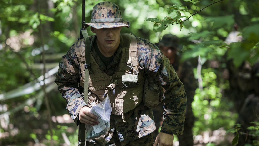 Candidates with India Company, Officer Candidate School, conduct the day compass course at Marine Corps Base Quantico, Virginia, July 17, 2016. The mission of OCS is to educate and train officer candidates in order to evaluate and screen individuals for qualities required for commissioning as a Marine Corps officer.