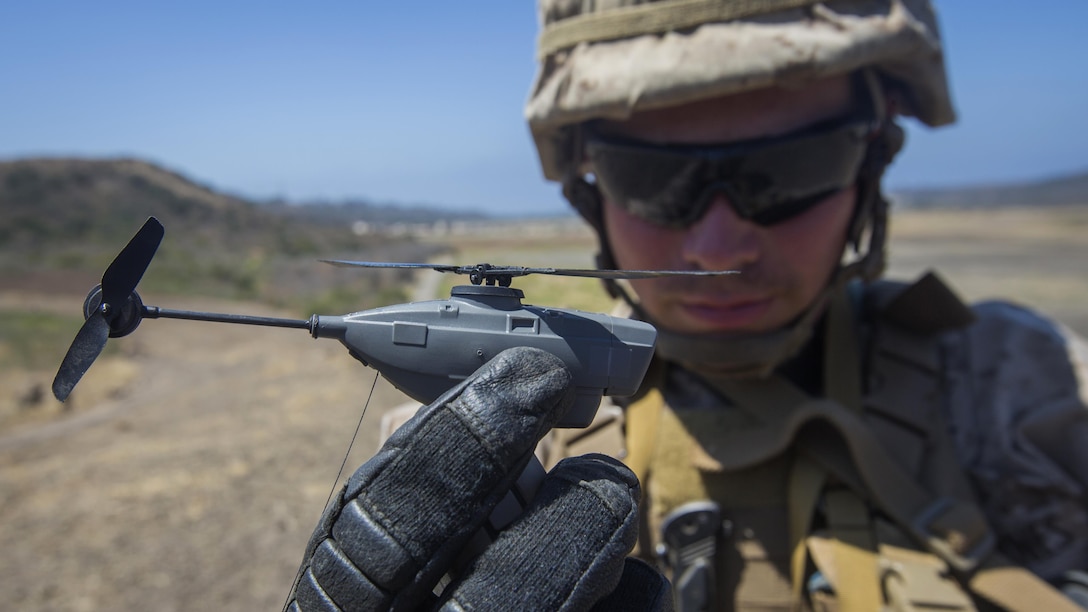 U.S.  Marine Lance Cpl. Cesar Salinas, an infantry Marine with Kilo Company, 3rd Battalion, 5th Marine Regiment, displays the PD-100 Black Hornet after an exercise for Marine Corps Warfighting Laboratory's Marine Air-Ground Task Force Integrated Experiment on Marine Corps Base Camp Pendleton, California, July 9, 2016. The Warfighting Lab is conducting an experiment in conjunction with the Rim of the Pacific exercise to explore new gear and assess its capabilities for potential future use. The Warfighting Lab identifies possible challenges of the future, develops new warfighting concepts, and tests new ideas to help develop equipment that meets the challenges of the future operating environment.