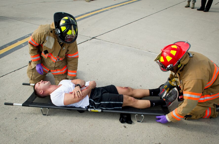Emergency response personnel assigned to Minot Air Force Base conducted a Major Accident Response Exercise July 15, 2016, in preparation for the upcoming Northern Neighbor’s Day Air Show scheduled for August 13. The training exercise simulated a UH-1N Huey accident with varying levels of injuries. Personnel conducted the drill to ensure they are ready for any aircraft emergencies. (U.S. Air Force photos/Senior Airman Apryl Hall/Senior Airman Sahara Fales)