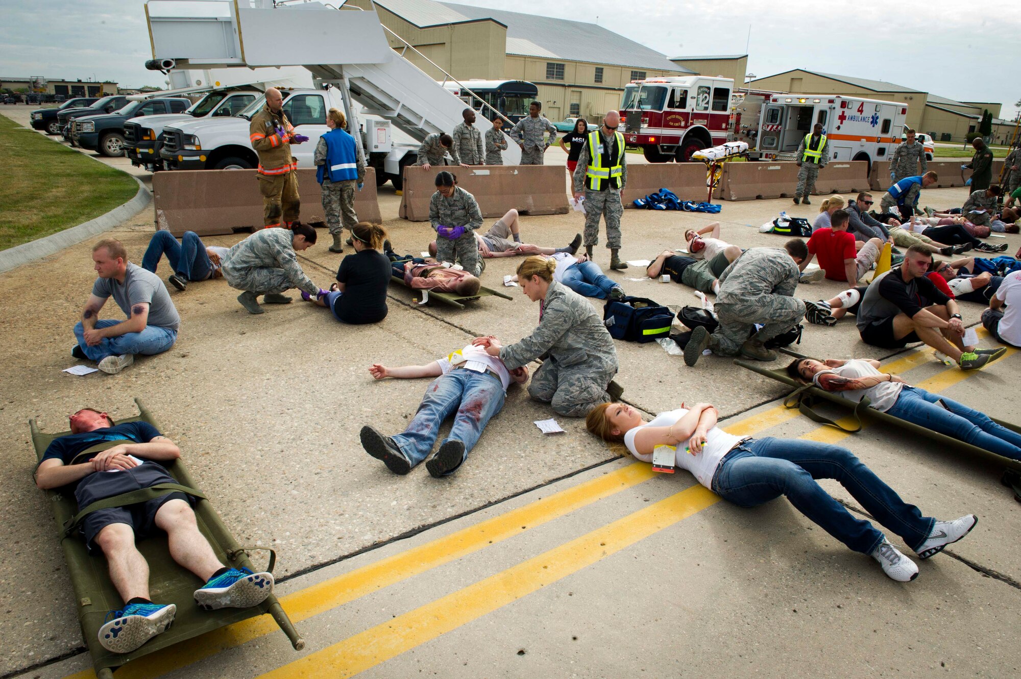 Emergency response personnel assigned to Minot Air Force Base conducted a Major Accident Response Exercise July 15, 2016, in preparation for the upcoming Northern Neighbor’s Day Air Show scheduled for August 13. The training exercise simulated a UH-1N Huey accident with varying levels of injuries. Personnel conducted the drill to ensure they are ready for any aircraft emergencies. (U.S. Air Force photos/Senior Airman Apryl Hall/Senior Airman Sahara Fales)