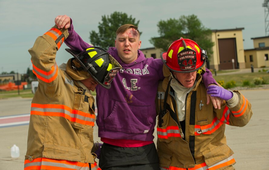 Emergency response personnel assigned to Minot Air Force Base conducted a Major Accident Response Exercise July 15, 2016, in preparation for the upcoming Northern Neighbor’s Day Air Show scheduled for August 13. The training exercise simulated a UH-1N Huey accident with varying levels of injuries. Personnel conducted the drill to ensure they are ready for any aircraft emergencies. (U.S. Air Force photos/Senior Airman Apryl Hall/Senior Airman Sahara Fales)