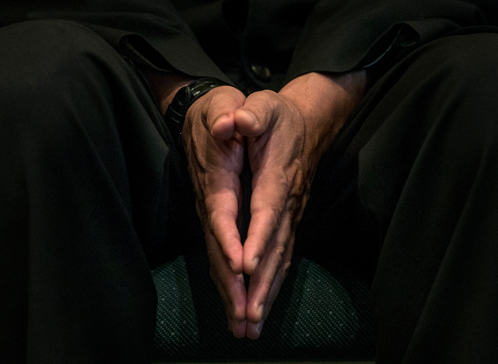 Father Carlos Bohorquez, Catholic priest, prays during an interfaith prayer service, Scott Air Force Base, July 15, 2016. The chapel held the prayer service in response to the shootings in Orlando, Falcon Heights, Baton Rouge, Dallas, and the attack that killed 84 in Nice, France.   The service included representatives from at least six religions, including the Hindu, Protestant, Islamic, Soka Gakkai International Buddhist, Catholic, and Greek Orthodox faiths.  (U.S. Air Force photo by Staff Sgt. Jodi Martinez/Released)