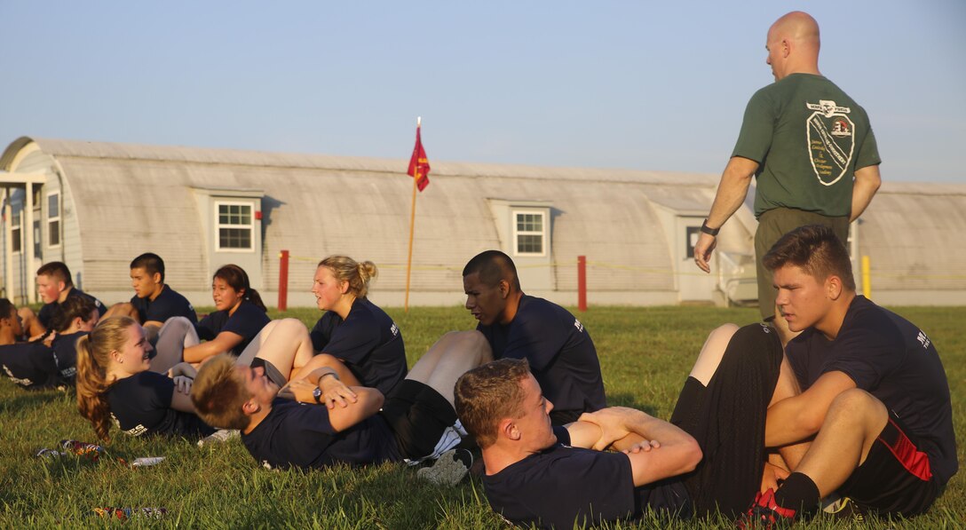 Students from Marine Corps Recruiting Command's Summer Leadership and Character Development Academy conduct crunches as part of their modified physical fitness tests July 20, 2016. SLCDA is part of the Marine Corps' community outreach program, designed to impart Marine Corps ethics, values, and leadership traits to high school Juniors and Seniors. 