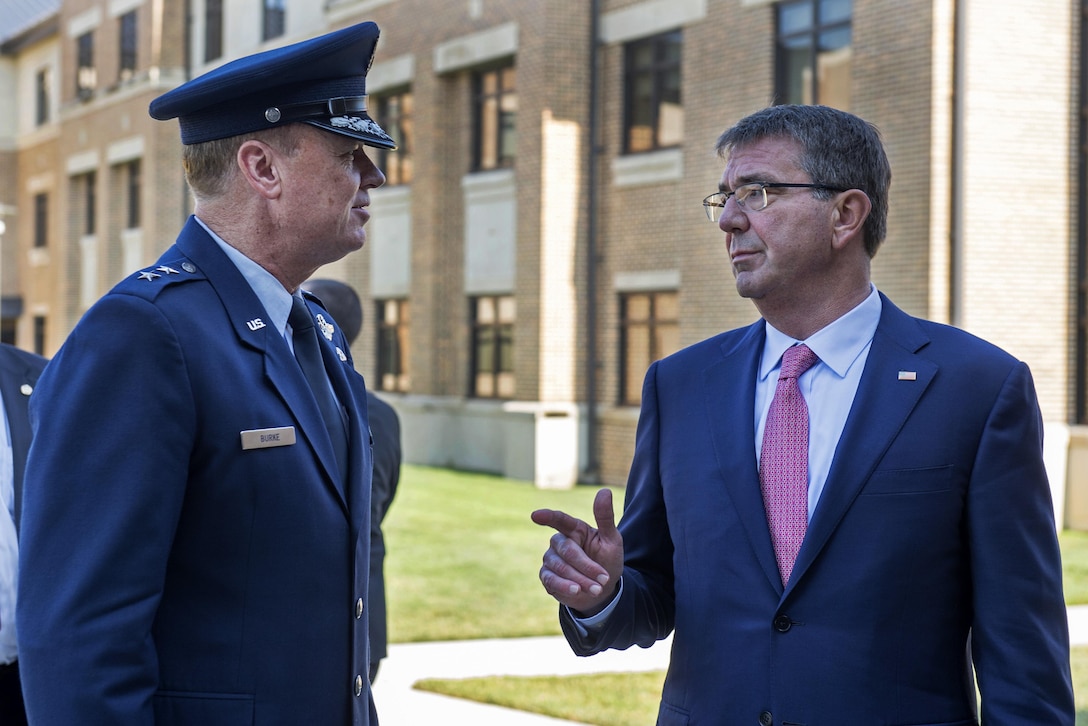 Defense Secretary Ash Carter, right, greets Air Force Maj. Gen. Darryl W. Burke, commander of the Air Force District of Washington and the 320th Air Expeditionary Wing, before a meeting with defense ministers and senior leaders from the coalition to counter the Islamic State of Iraq and the Levant at Joint Base Andrews, Md., July 20, 2016. DoD photo by Air Force Tech. Sgt. Brigitte N. Brantley