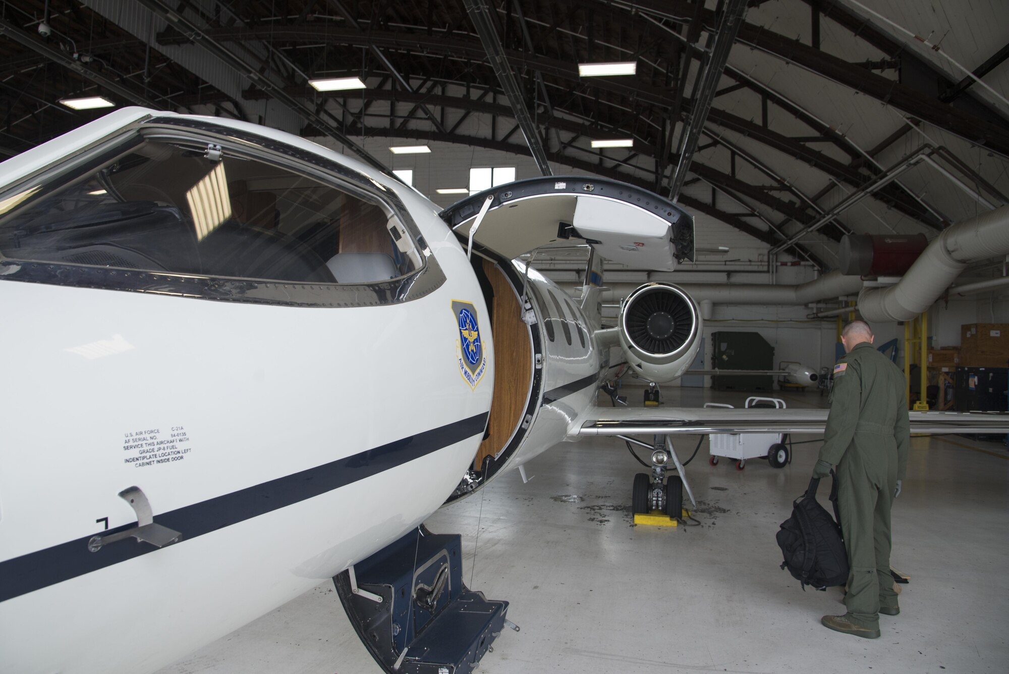 Major Brian Jones, 458th Assistant Chief of Training, works on pre-flight checks July 6, 2016 at Scott Air Force Base, Illinois. The visual inspection or walk around is done by the pilot as the final airworthiness check. (U.S. Air Force photo by Airman 1st Class Gwendalyn Smith)
