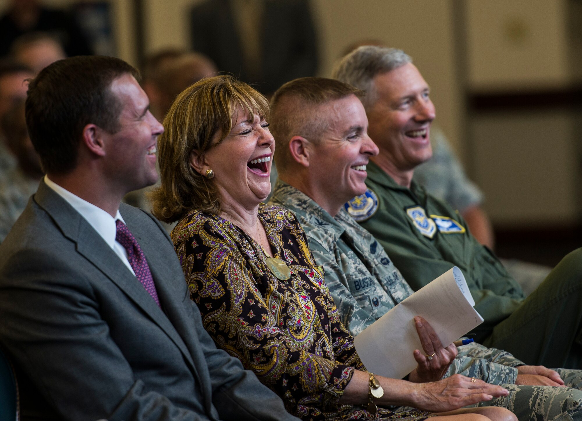 Members of the audience laugh during a two-day transition summit and hiring and education fair for transitioning members, veterans, and spouses, Scott Air Force Base, Ill., July 12, 2016.  The first day of the transition summit offered industry briefs from Microsoft, the 375th Communications Group, Alcoa, Fastport, and SSM Health to transitioning service members, veterans, and military spouses, followed by a panel discussion with senior leaders of potential employers that answered questions of audience members on the transitioning process. The second day featured employment workshops, another panel discussion on different transition perspectives, and a hiring and education fair.   (U.S. Air Force photo by Staff Sgt. Jodi Martinez/Released)