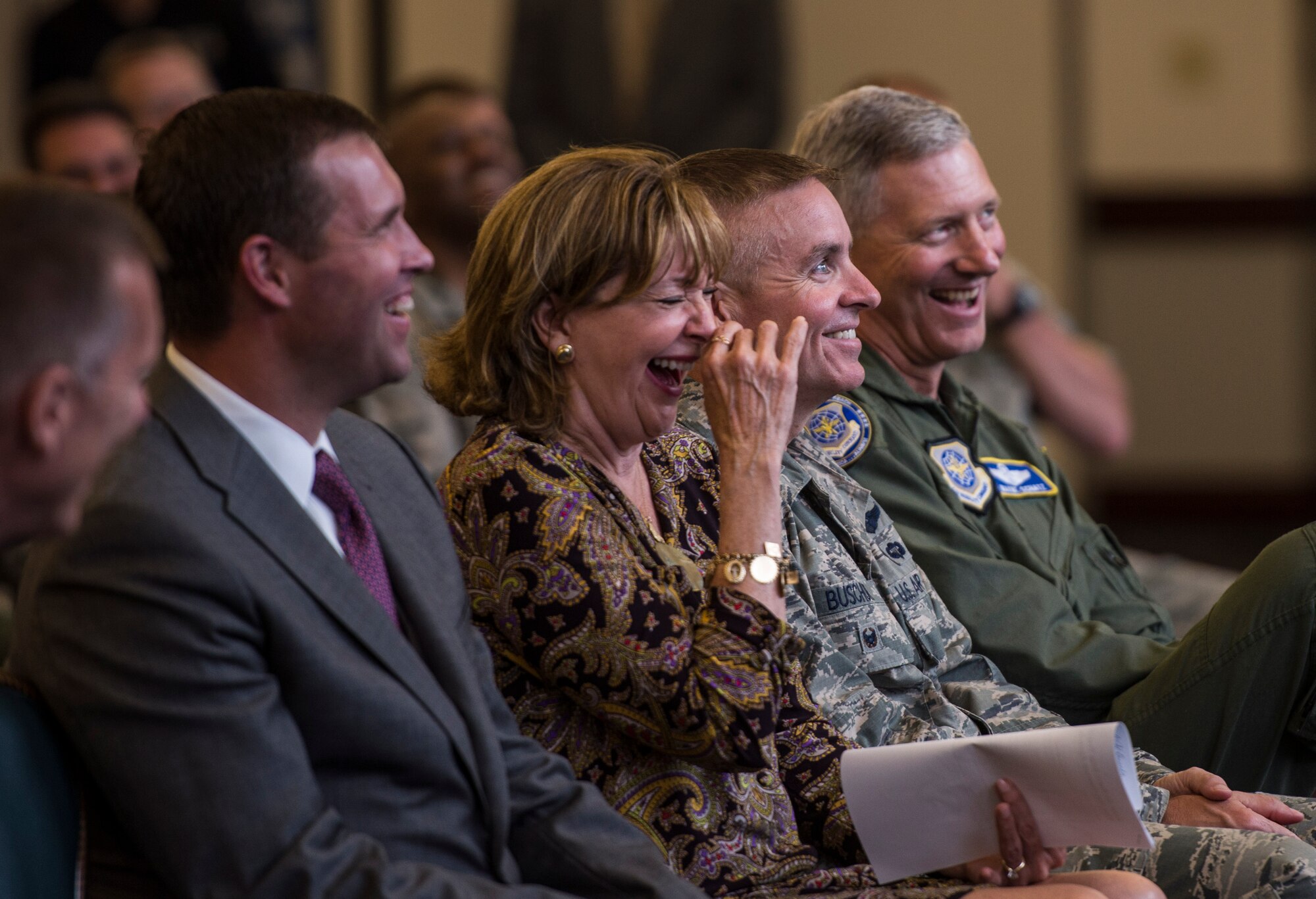 Members of the audience laugh during a two-day transition summit and hiring and education fair for transitioning members, veterans, and spouses, Scott Air Force Base, Ill., July 12, 2016.  The first day of the transition summit offered industry briefs from Microsoft, the 375th Communications Group, Alcoa, Fastport, and SSM Health to transitioning service members, veterans, and military spouses, followed by a panel discussion with senior leaders of potential employers that answered questions of audience members on the transitioning process. The second day featured employment workshops, another panel discussion on different transition perspectives, and a hiring and education fair.   (U.S. Air Force photo by Staff Sgt. Jodi Martinez/Released)
