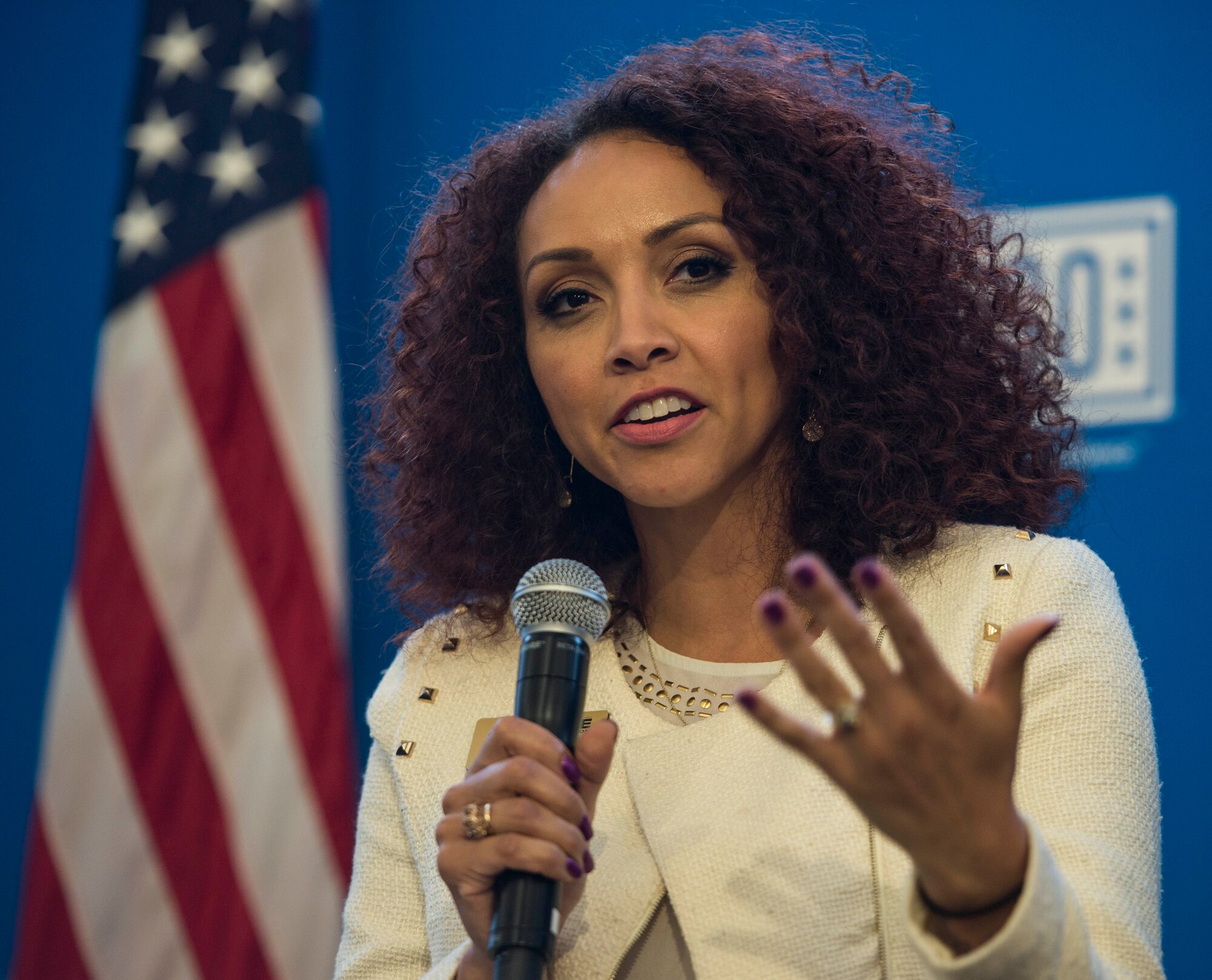 Betty Hart, the Transition Assistance Program manager, speaks during a two-day transition summit and hiring and education fair for transitioning members, veterans, and spouses, Scott Air Force Base, Ill., July 12, 2016. The transition summit offered industry briefs from Microsoft, the 375th Communications Group, Alcoa, Fastport, and SSM Health to transitioning service members, veterans, and military spouses, followed by a panel discussion with senior leaders of potential employers that answered questions of audience members on the transitioning process. The second day featured employment workshops, another panel discussion on different transition perspectives, and a hiring and education fair.   (U.S. Air Force photo by Staff Sgt. Jodi Martinez/Released)