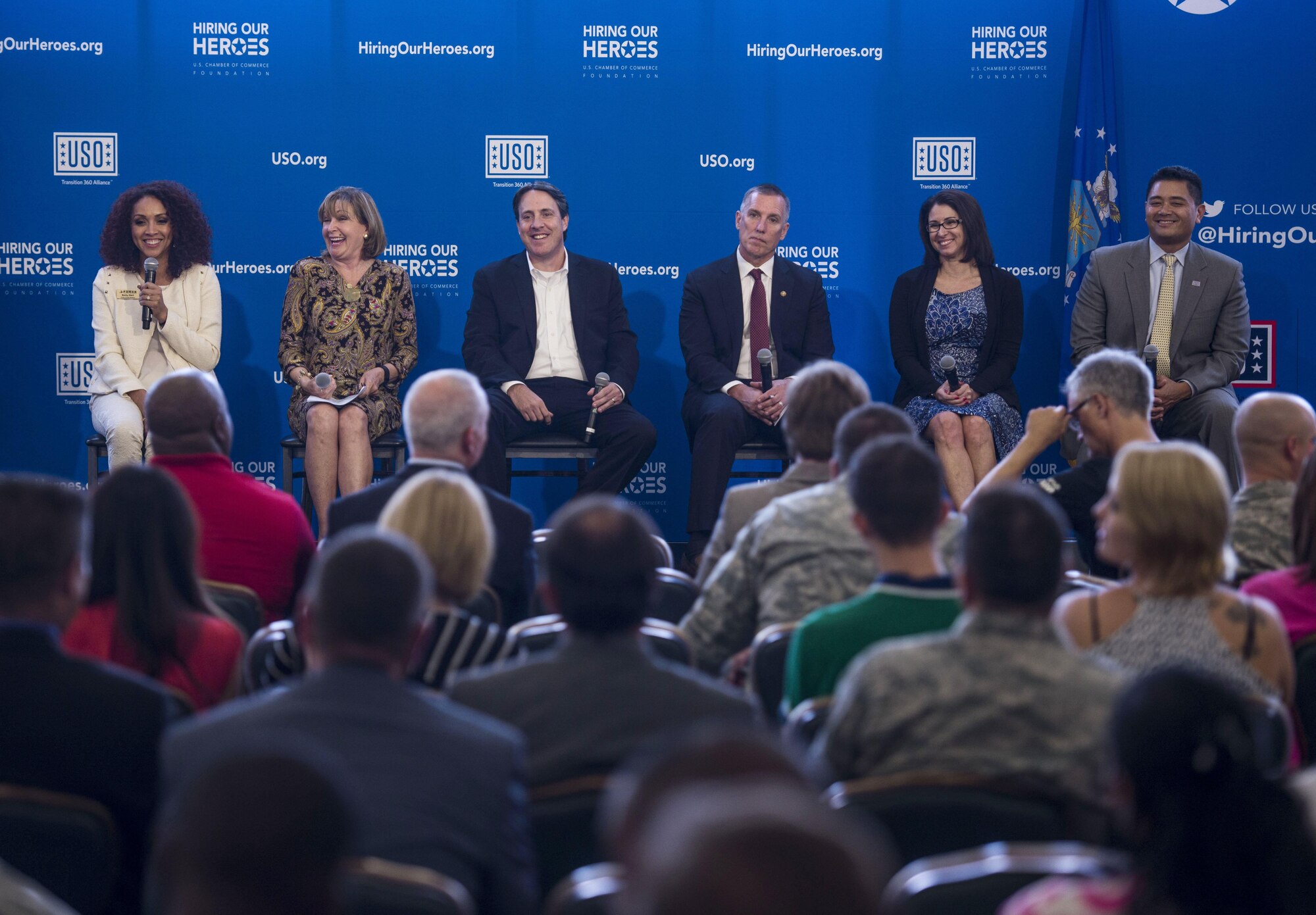 A panel answers questions of the audience during a two-day transition summit and hiring and education fair for transitioning members, veterans, and spouses, Scott Air Force Base, Ill., July 12, 2016. The transition summit offered industry briefs from Microsoft, the 375th Communications Group, Alcoa, Fastport, and SSM Health to transitioning service members, veterans, and military spouses, followed by a panel discussion with senior leaders of potential employers that answered questions of audience members on the transitioning process. The second day featured employment workshops, another panel discussion on different transition perspectives, and a hiring and education fair.   (U.S. Air Force photo by Staff Sgt. Jodi Martinez/Released)