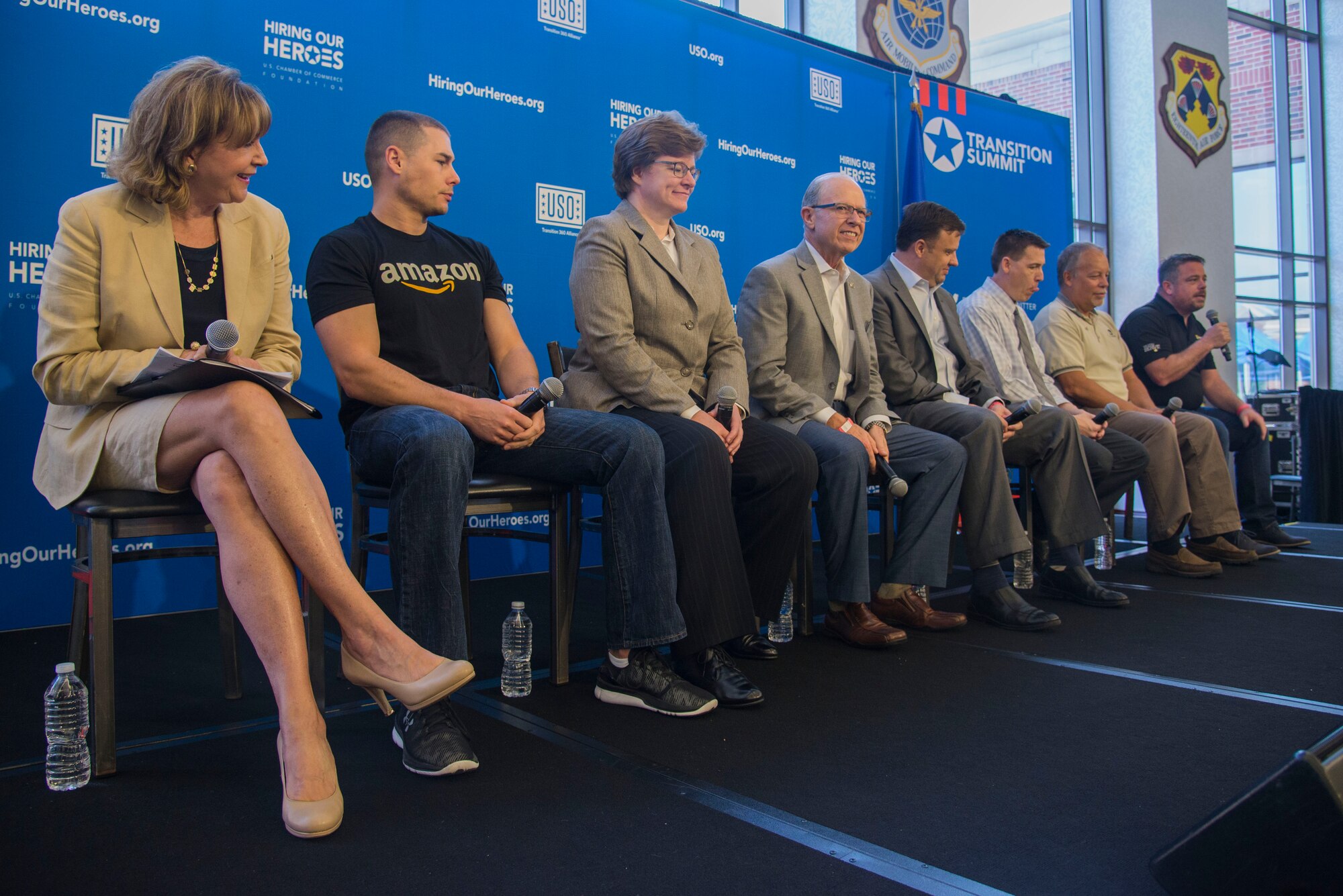 Panel members from various companies answer the questions of members from Team Scott during a free hiring fair and transition summit at Scott Air Force Base, Ill. on July 13, 2016. The first day of the transition summit offered industry briefs from Microsoft, the 375th Communications Group, Alcoa, Fastport, and SSM Health to transitioning service members, veterans, and military spouses, followed by a panel discussion with senior leaders of potential employers that answered questions of audience members on the transitioning process. The second day featured employment workshops, another panel discussion on different transition perspectives, and a hiring and education fair.  (U.S. Air Force Photo by Airman Daniel Garcia)
