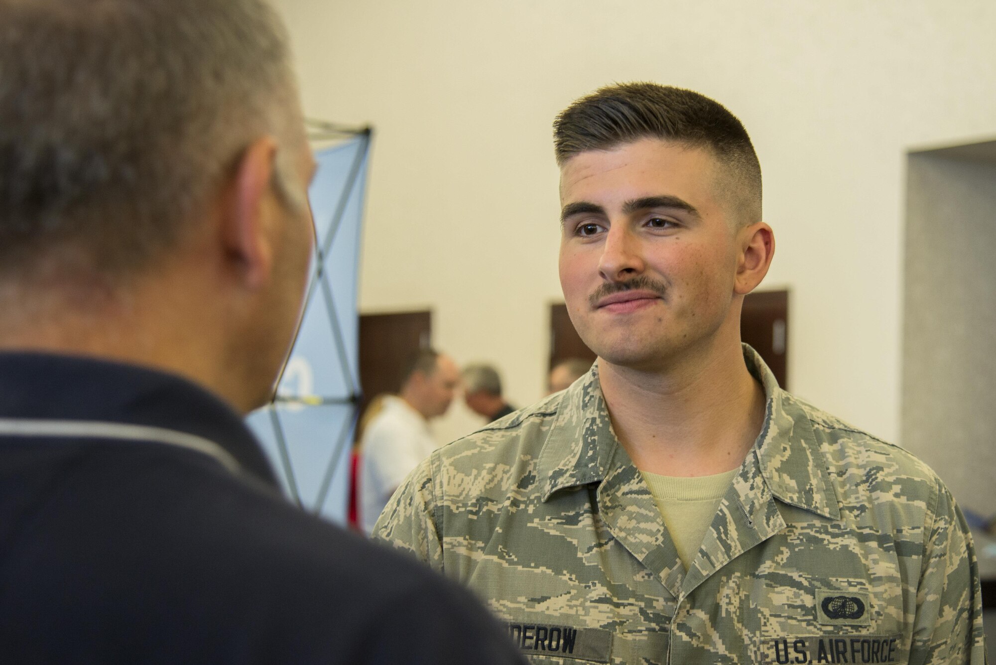 Airman 1st Class Anthony Rudderow, 375th Contracting Squadron contracting specialist, attended a free hiring fair and transition summit at Scott Air Force Base, Ill. on July 13, 2016. "For me, it's about being able to go and see what people are looking for in the private sector so I can make sure I'm staying on par with what they're expecting in terms of new hires," said Rudderow. The first day of the transition summit offered industry briefs from Microsoft, the 375th Communications Group, Alcoa, Fastport, and SSM Health to transitioning service members, veterans, and military spouses, followed by a panel discussion with senior leaders of potential employers that answered questions of audience members on the transitioning process. The second day featured employment workshops, another panel discussion on different transition perspectives, and a hiring and education fair.  (U.S. Air Force Photo by Airman Daniel Garcia)