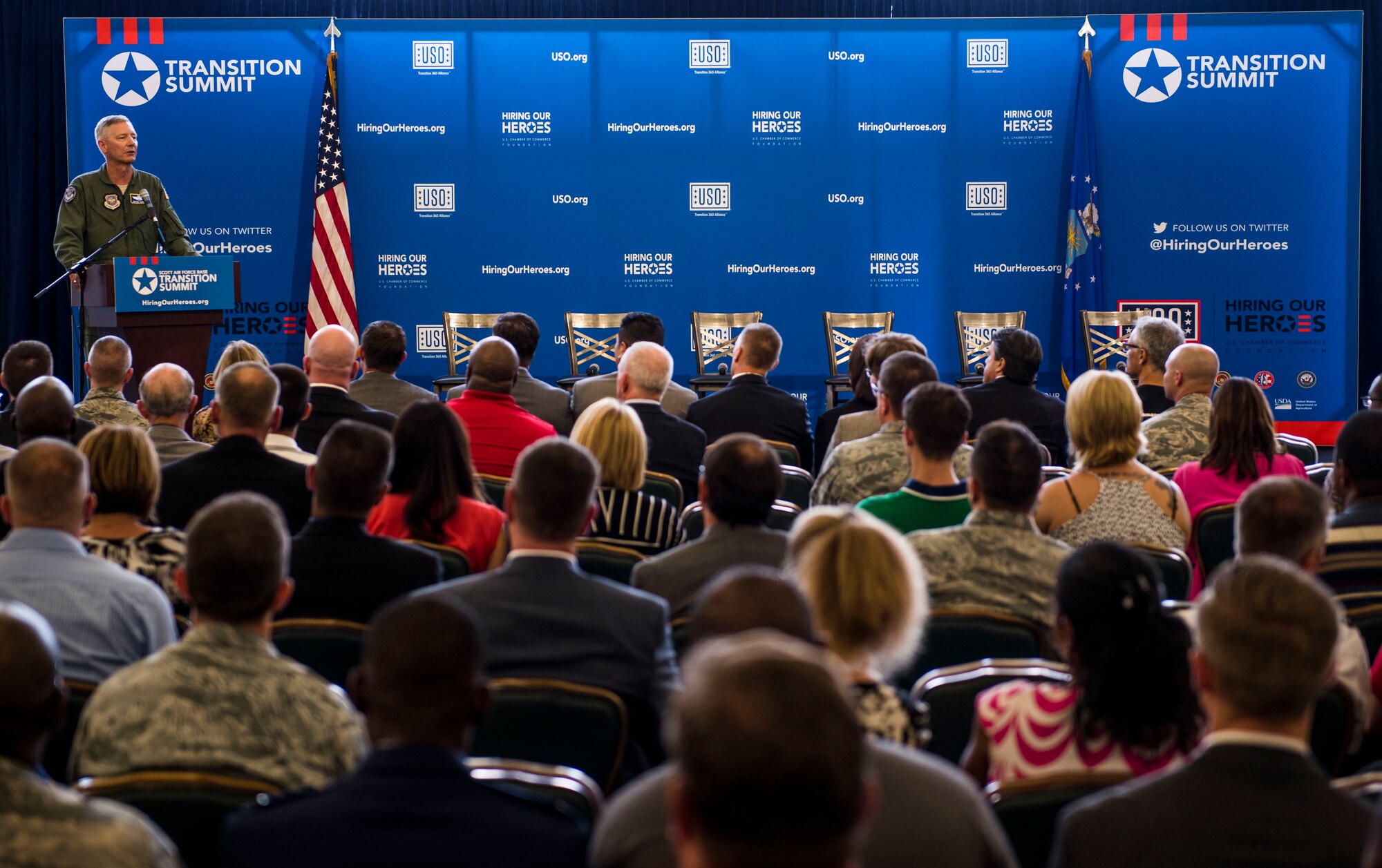 Maj. Gen. Rowayne Schatz Jr., Air Mobility Command vice commander, speaks during a two-day transition summit and hiring and education fair for transitioning members, veterans, and spouses, Scott Air Force Base, Ill., July 12, 2016.  The first day of the transition summit offered industry briefs from Microsoft, the 375th Communications Group, Alcoa, Fastport, and SSM Health to transitioning service members, veterans, and military spouses, followed by a panel discussion with senior leaders of potential employers that answered questions of audience members on the transitioning process. The second day featured employment workshops, another panel discussion on different transition perspectives, and a hiring and education fair.   (U.S. Air Force photo by Staff Sgt. Jodi Martinez/Released)