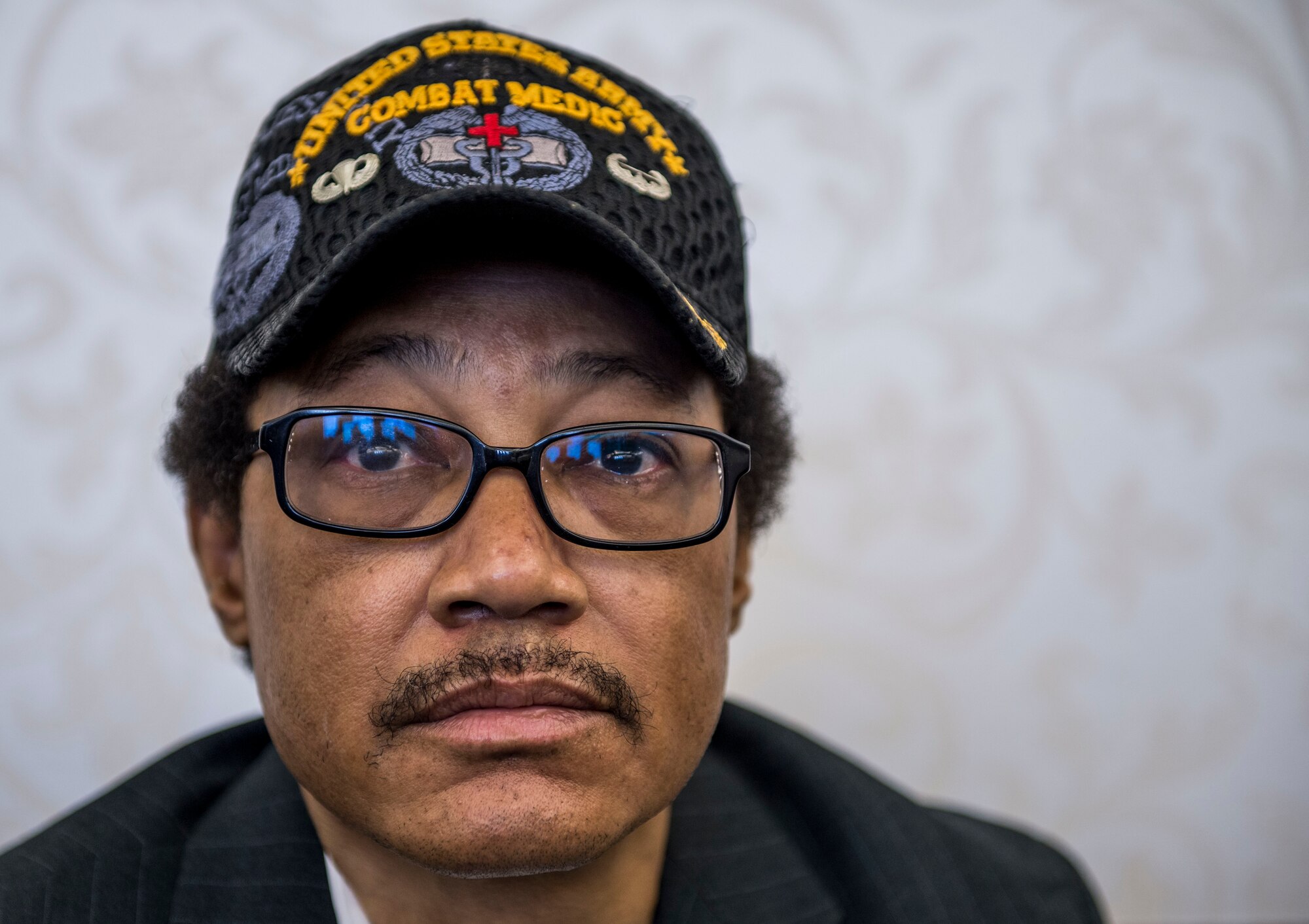 54-year-old Lavor D. White Sr., a former Army medic who served for 23 years, attends the transition summit after being out of work for over a decade due to injuries suffered while serving in the military, including a helicopter crash, an air assault accident, and a 250 ft. fall.  He brought his binder that holds all of his training certificates and important memories during his military career.  "I am willing to try anything," White said.  "I just want to get off the couch and live again." The first day of the transition summit offered industry briefs from Microsoft, the 375th Communications Group, Alcoa, Fastport, and SSM Health to transitioning service members, veterans, and military spouses, followed by a panel discussion with senior leaders of potential employers that answered questions of audience members on the transitioning process. The second day featured employment workshops, another panel discussion on different transition perspectives, and a hiring and education fair.   (U.S. Air Force photo by Staff Sgt. Jodi Martinez/Released)