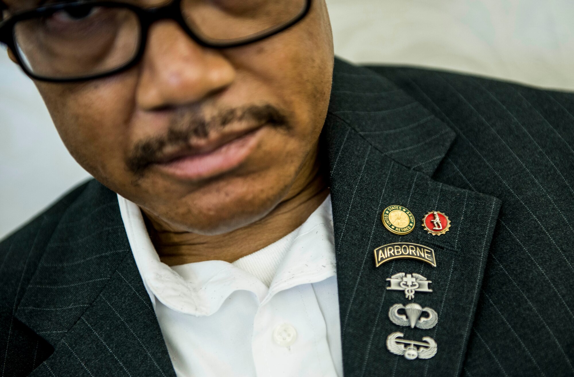 54-year-old Lavor D. White Sr., a former Army medic who served for 23 years, attends the transition summit after being out of work for over a decade due to injuries suffered while serving in the military, including a helicopter crash, an air assault accident, and a 250 ft. fall.  He brought his binder that holds all of his training certificates and important memories during his military career.  "I am willing to try anything," White said.  "I just want to get off the couch and live again." The first day of the transition summit offered industry briefs from Microsoft, the 375th Communications Group, Alcoa, Fastport, and SSM Health to transitioning service members, veterans, and military spouses, followed by a panel discussion with senior leaders of potential employers that answered questions of audience members on the transitioning process. The second day featured employment workshops, another panel discussion on different transition perspectives, and a hiring and education fair.   (U.S. Air Force photo by Staff Sgt. Jodi Martinez/Released)