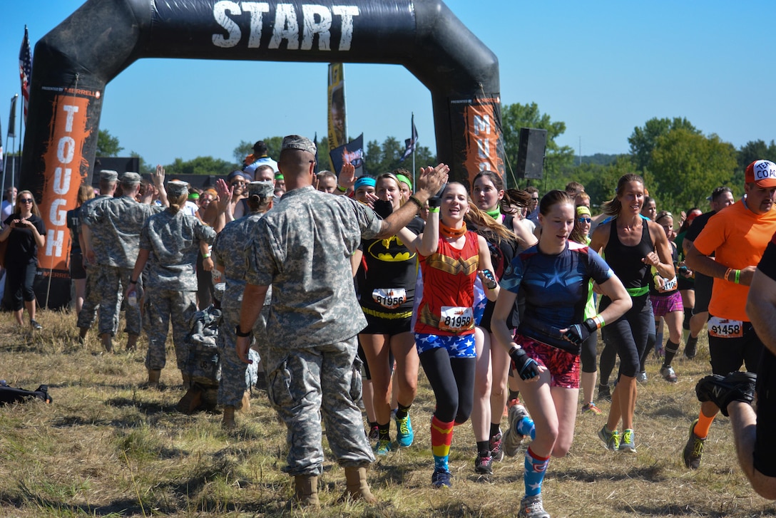 HUGO, Minn. -- Army Reserve Soldiers motivate Tough Mudder participants as they make their way through the start line of the Hugo, Minnesota, event July 16. Hugo was the location for the Army Reserve-sponsored race held July 16 and 17, 2016. For the past several years the U.S. Army Reserve has joined forces with Tough Mudder in an effort to strengthen its partnership with the local community, while fostering the resilience of Soldiers, Families, and Civilians.