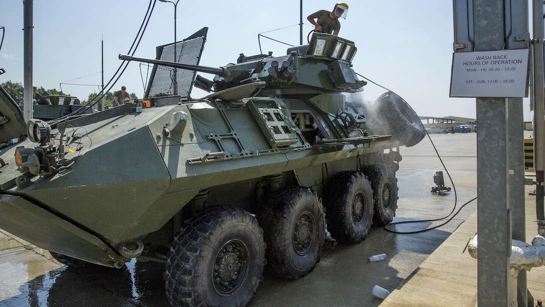U.S. Marine Corps Lance Cpl. Julian O. Ibarra, a driver with Black Sea Rotational Force, washes a Light Armored Vehicle at the end of Exercise Platinum Lion 16-4 at Novo Selo Training Area, Bulgaria, July 15, 2016. This multi-national exercise brings together eight NATO and partner nations for a live-fire exercise aimed to strengthen regional defense in Eastern Europe.