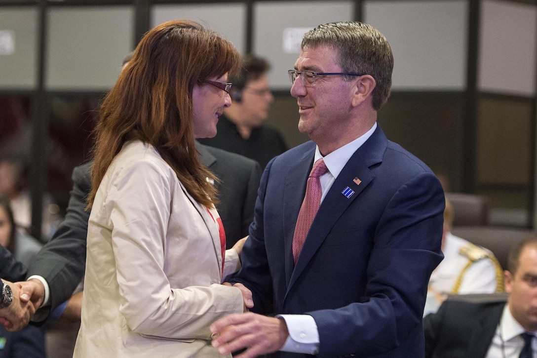 Defense Secretary Ash Carter greets Slovenian Defense Minister Andreja Katic during a meeting of defense ministers and senior leaders from the coalition to counter the Islamic State of Iraq and the Levant at Joint Base Andrews, Md., July 20, 2016. DoD photo by Air Force Tech. Sgt. Brigitte N. Brantley