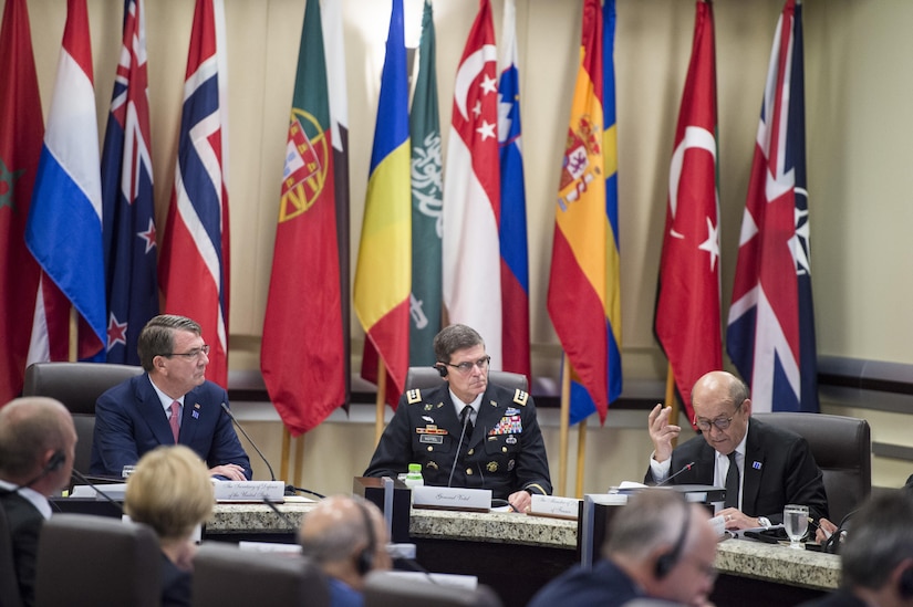 Defense Secretary Ash Carter, left back, listens to remarks from French Defense Minister Jean-Yves Le Drian, right back, during a meeting of defense ministers and senior leaders from the coalition to counter the Islamic State of Iraq and the Levant at Joint Base Andrews, Md., July 20, 2016. DoD photo by Air Force Tech. Sgt. Brigitte N. Brantley