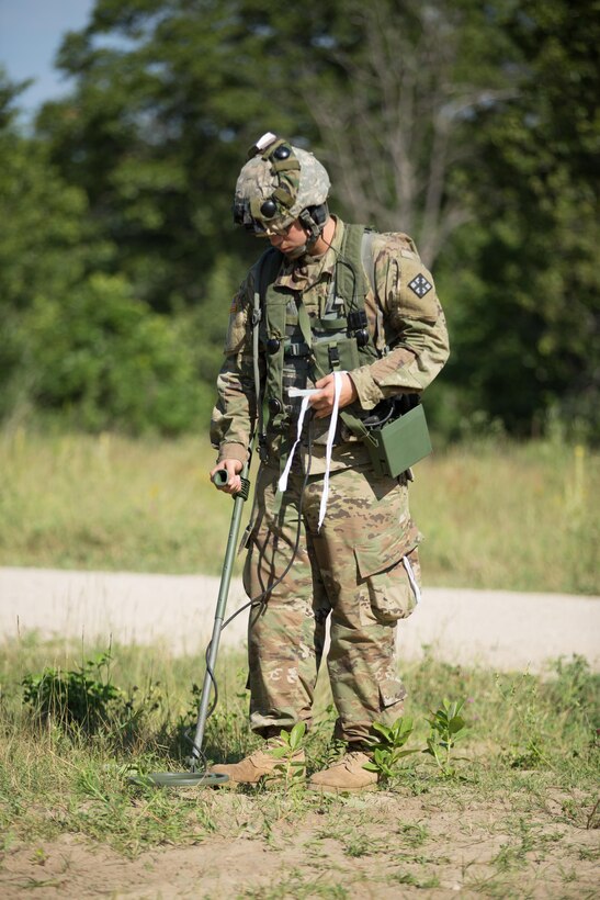 U.S. Army Spc. Asa Battle, 479th Engineer Company, Fayville, N.C., use a mine detector to search for inert mines during Warrior Exercise (WAREX) 86-16-03 at Fort McCoy, Wis., July 16, 2016. WAREX is designed to keep soldiers all across the United States ready to deploy. (U.S. Army photo by Sgt. Robert Farrell/Released)