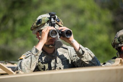 U.S. Army Staff Sgt. Brandon Coffey, 366th Engineer Company, Canton N.Y., watches soldiers through binoculars during a mine clearing exercise during Warrior Exercise (WAREX) 86-16-03 at Fort McCoy, Wis., July 16, 2016. WAREX is designed to keep soldiers all across the United States ready to deploy. (U.S. Army photo by Sgt. Robert Farrell/Released)