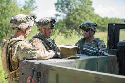 U.S. Army Sgt. Cody Canipe (middle), 366th Engineer Company, Pension, N.C., prepares inert demolition charges with fellow soldiers during a mine clearing exercise during Warrior Exercise (WAREX) 86-16-03 at Fort McCoy, Wis., July 16, 2016. WAREX is designed to keep soldiers all across the United States ready to deploy. (U.S. Army photo by Sgt. Robert Farrell/Released)