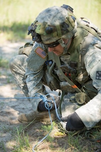 U.S. Army Sgt. Thomas Emburey, 366th Engineer Company, Colton, N.Y., prepares inert demolition charges during a mine clearing exercise during Warrior Exercise (WAREX) 86-16-03 at Fort McCoy, Wis., July 16, 2016. WAREX is designed to keep soldiers all across the United States ready to deploy. (U.S. Army photo by Sgt. Robert Farrell/Released)