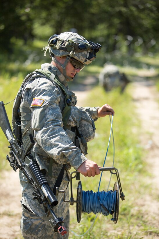 U.S. Army Pvt. Garrett Corlew, 366th Engineer Company, Lake Luzern, N.Y., prepares inert demolition charges during a mine clearing exercise during Warrior Exercise (WAREX) 86-16-03 at Fort McCoy, Wis., July 16, 2016. WAREX is designed to keep soldiers all across the United States ready to deploy. (U.S. Army photo by Sgt. Robert Farrell/Released)