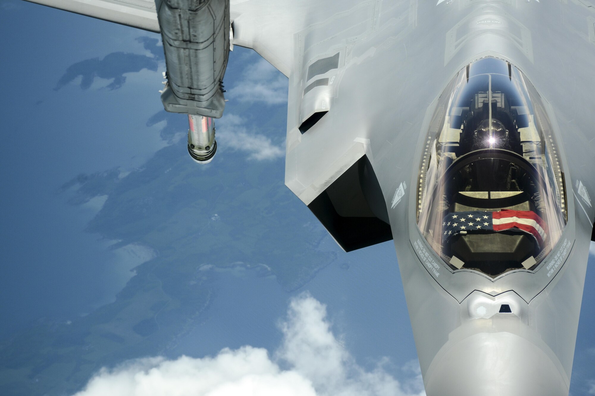An F-35A Lightning II approaches the Travis KC-10 Extender to receive fuel from the boom as the planes cross the Atlantic Ocean July 13, 2016. An aircrew of 70th Air Refueling Squadron members departed Travis Air Force Base, Calif., July 11, 2016 en route to Royal Air Force Base Fairford in Gloucestershire, England. The purpose of the trip is to refuel F-35A Lightning II jet fighters that are returning to the United States after participating in the world's largest air show. (U.S. Air Force photos by Staff Sgt. Madelyn Brown)