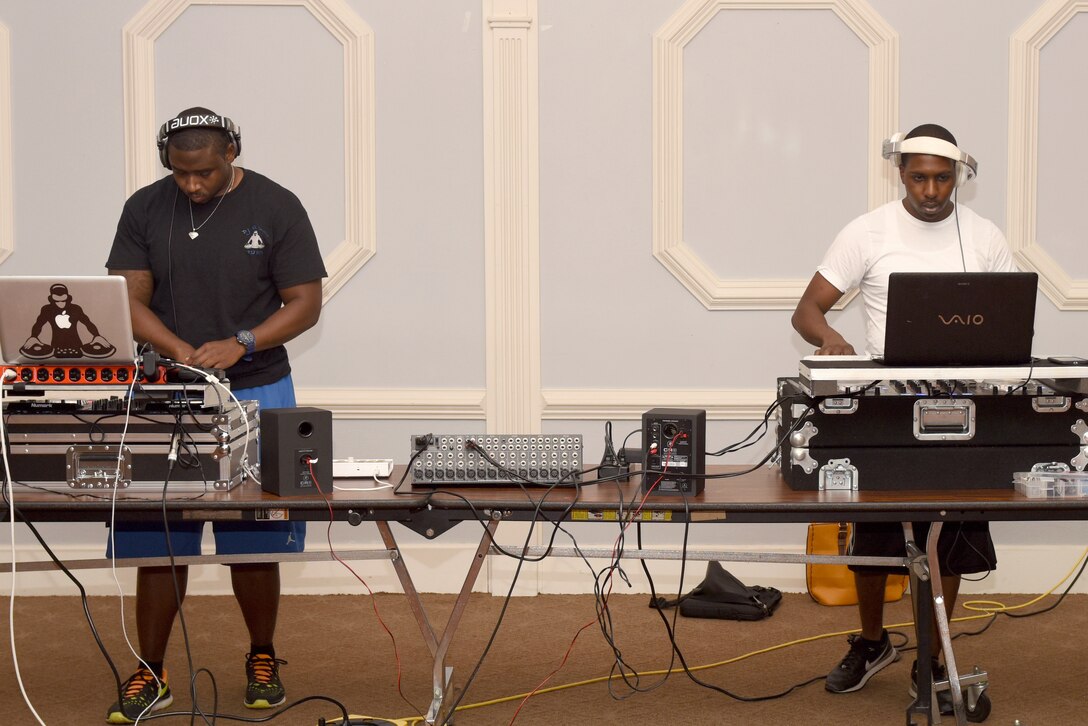 Senior Airman Christopher Allen (left), 4th Maintenance Group integrated avionics technician, and Staff Sgt. Jonathan Gambrell, 4th Equipment Maintenance Squadron supply liaison, practice mixing different beats during the Make it Better DJ and Producers Club meeting July 17, 2016, at Seymour Johnson Air Force Base, North Carolina. Allen and Gambrell have more than six years of turntable mixing experience between them. (U.S. Air Force photo by Airman Miranda Loera)