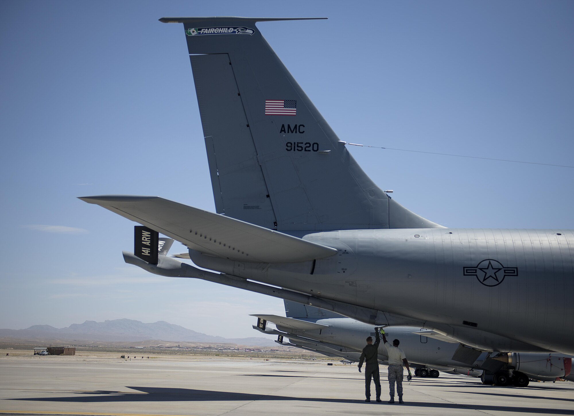 Capt. Dan Fenwick, a KC-135 Stratotanker pilot from MacDill Air Force Base, talks to Staff Sgt. Brandon Richardson as part of the pre-flight checks at Nellis Air Force Base, Nevada July 18, 2015 during exercise Red Flag. Red Flag 16-3 is one of four Red Flag exercises at Nellis--this edition of Red Flag focusing on multi-domain operations in air, space and cyberspace. (U.S. Air Force photo/Tech. Sgt. David Salanitri)