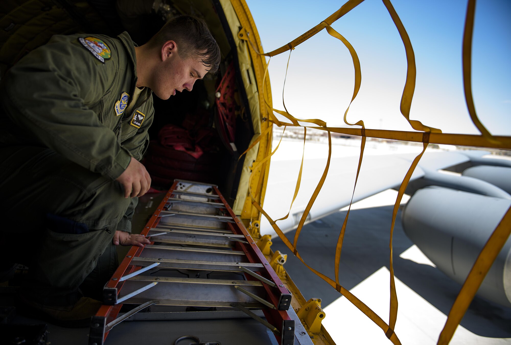 Senior Airman Jordan Webber, a KC-135 Stratotanker boom operator from MacDill Air Force Base, double checks gear is where it needs to be shortly before an refueling mission at Nellis Air Force Base, Nevada July 18, 2015 during exercise Red Flag. Red Flag 16-3 is one of four Red Flag exercises at Nellis--this edition of Red Flag focusing on multi-domain operations in air, space and cyberspace. (U.S. Air Force photo/Tech. Sgt. David Salanitri)