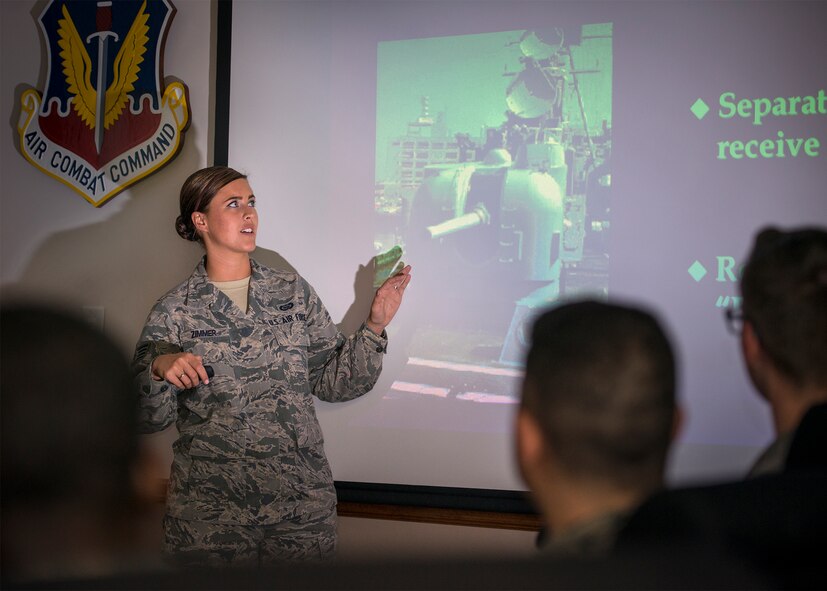 U.S. Air Force Staff Sgt. Jamie Zimmer, 347th Operations Support Squadron intelligence analyst, gives a briefing on radar systems and foreign threats, June 29, 2016, at Moody Air Force Base, Ga. Zimmer was credited with providing mission-critical intel support during exercises TRIDENT JUNCTURE and BOARS NEST as well as two 23d Wing combat search and rescue exercises. (U.S. Air Force photo by Senior Airman Ryan Callaghan)