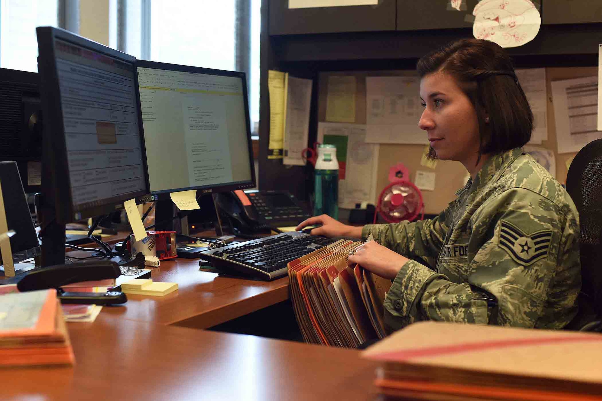 Staff Sgt. Anais Lopez Quinones, 341st Force Support Squadron career development supervisor for outbound assignments, handles personnel records July 20, 2016, at Malmstrom Air Force Base, Mont. The 341st FSS military personnel section received a 2015 A1 Award at the Air Force level for exceeding Air Force standards. (U.S. Air Force photo/Amn Collin Schmidt)	