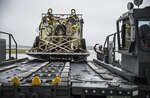 (July 17, 2016) - A loadcrew member directs an Airman operating a k-loader at Misawa Air Base.  Airmen from the 35th Logistics Readiness Squadron loaded more than BLANK lbs of cargo for Exercise Pitch Black. Exercise Pitch Black enhances the partnerships Australia has with the participing nations, and the high value it places on regional security and fostering closer ties throughout the Asia Pacific region.