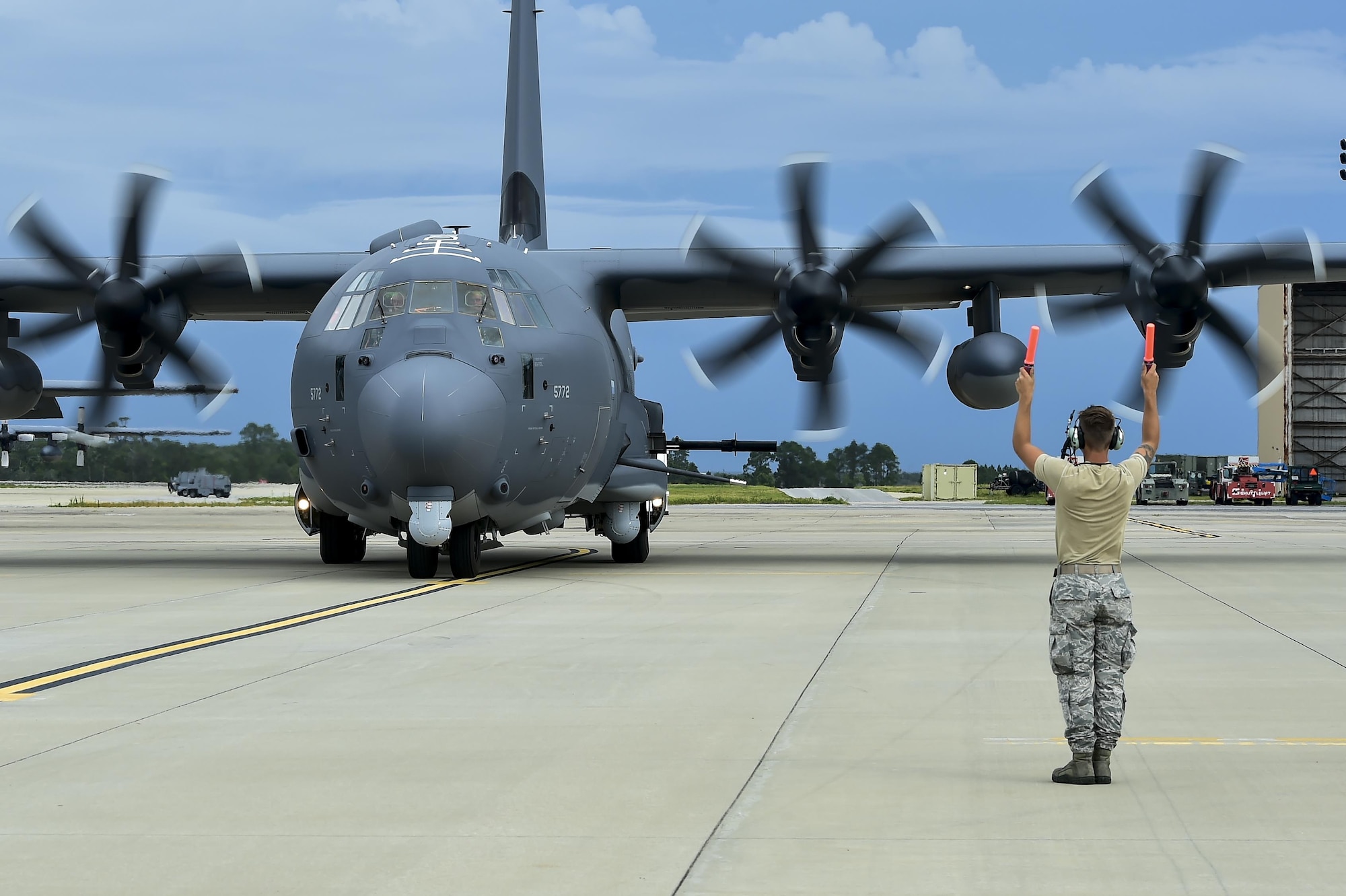 A newly arrived AC-130J Ghostrider gunship, Block 20 model, is marshaled into a parking spot at Hurlburt Field, Fla., July 18, 2016. The AC-130J is the fourth generation gunship replacing the aging fleet of AC-130U/W gunships. Over the past four decades, AC-130s have deployed constantly to hotspots throughout the world in support of special operations and conventional forces. (U.S. Air Force by Senior Airman Jeff Parkinson)